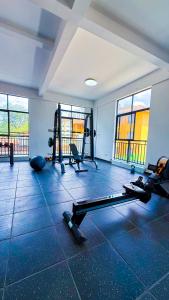 a gym with several tread machines in a room at SPOTLESS HOSTEL, WESTLANDs Orc in Nairobi