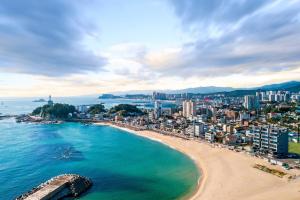 an aerial view of a beach and a city at Soakcho Pool View Spa Pool Villa in Sokcho