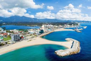 an aerial view of a beach and the ocean at Soakcho Pool View Spa Pool Villa in Sokcho