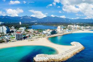 an aerial view of a beach and the ocean at Soakcho Pool View Spa Pool Villa in Sokcho
