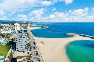 an aerial view of a beach and the ocean at Soakcho Pool View Spa Pool Villa in Sokcho