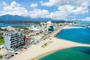 an aerial view of a beach and the ocean at Soakcho Pool View Spa Pool Villa in Sokcho +2 photos