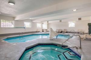 a pool in a hotel room with a swimming pool at Quality Inn & Suites Gallup I-40 Exit 20 in Gallup