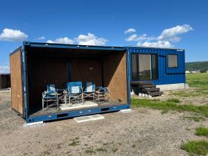 a large blue shipping container with chairs in it at Villa ORAN in Nakafurano