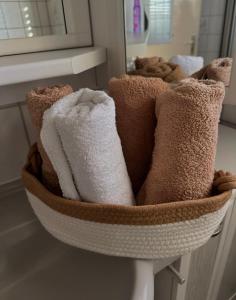 a basket filled with towels in a bathroom at Sternlicht Rachida in Albstadt +29 photos