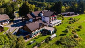 an aerial view of a large house with a yard at Naturgut Gailtal in Sankt Stefan an der Gail