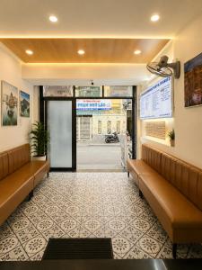 a waiting room with couches in a hospital at Atusy Hotel in Ho Chi Minh City