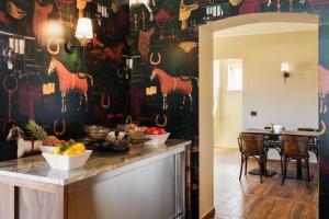 a kitchen with a table with fruits on it at ISSA Village in Turda
