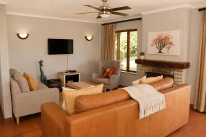 a living room with a couch and a fireplace at 26 on Greenway in White River