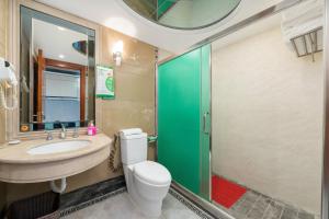 a bathroom with a toilet and a sink and a shower at Louidon Mega Duplex Apartment - Beijing Rd in Guangzhou +92 photos