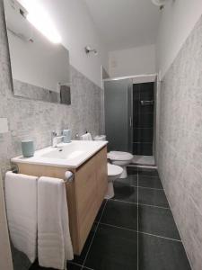 a bathroom with a sink and a toilet at Orto dei Frati in Sortino +40 photos