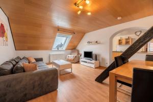 a living room with a couch and a table at Am Fabianstift 1 in Hornbach