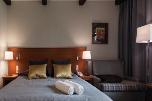 Postel nebo postele na pokoji v ubytování Hotel SPA Dr Irena Eris Wzgórza Dylewskie