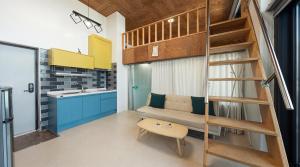 a small room with a bunk bed and a kitchen at Capella Oceanview Spa Resort – Goseong in Goseong