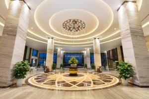 a lobby of a building with a large ceiling at DIC Star Villas Vinh Phuc in Vị Trù +10 photos