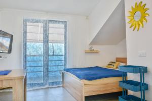 a bedroom with a bed and a window at Apartments Miki in Donja Klada +58 photos