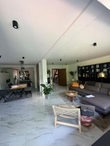 a large living room with a couch and a table at A nice cozy romantic home in Bielefeld