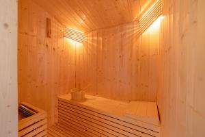 a wooden sauna with a tub in a room at Sterling Ameris Kasauli in Kasauli +45 photos