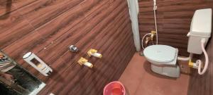 an overhead view of a bathroom with a toilet at RADHA Homestay in Mathura +82 photos