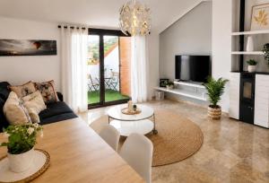 a living room with a couch and a table at El Respiro in Ruidera