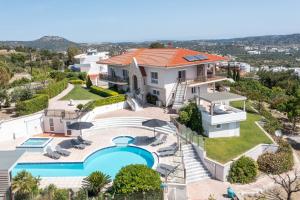 an aerial view of a house with a swimming pool at Elysian View Estate in Faliraki