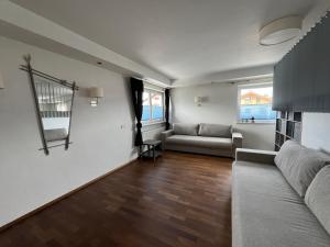 a living room with a couch and a table at chapter-one in Innsbruck