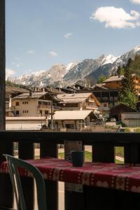 a table and chairs with a view of a mountain at Chardonneret 3 in La Clusaz
