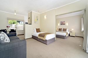Postel nebo postele na pokoji v ubytování Takapuna Motor Lodge