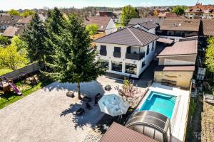 an aerial view of a house with a swimming pool at San Marco - Na Brněnské ulici in Mutěnice
