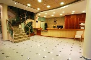 a lobby with a staircase in a hospital at Aparthotel Bahía in San Pedro del Pinatar