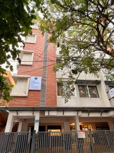 a building with a fence in front of it at The Staying Co in Bangalore