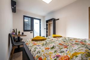 a bedroom with a bed and a table and a window at San Marco - Na Brněnské ulici in Mutěnice +41 photos