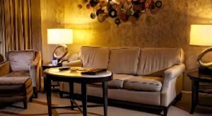 a living room with a couch and a table at Harrahs Hotel Reno in Reno