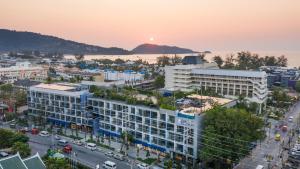 an aerial view of a city at sunset at Hotel Indigo Phuket Patong by IHG in Patong Beach