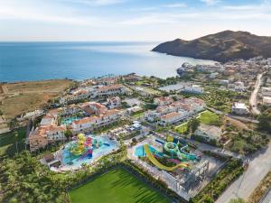 an aerial view of a water park next to the ocean at Grecotel Marine Palace & Aqua Park in Panormos Rethymno +107 photos