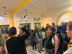 a group of people standing in a room at Seventh Heaven Inn Rishikesh in Rishīkesh