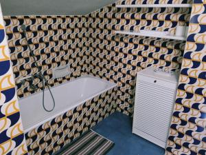 a bathroom with a bath tub and a shower at Appartamento La Primula in Madesimo