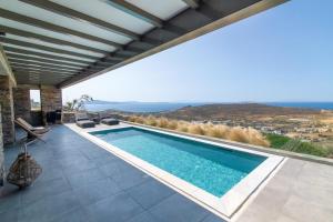 a swimming pool in a villa with a view at Tinos Prinos 3 in Agios Fokas