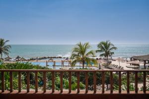 a view of the beach from the balcony of a resort at Royal Horizon Baobab in Somone