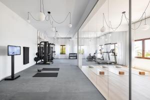 a large room with a gym with a treadmill at One Shot Buenavista in Santa Eularia des Riu