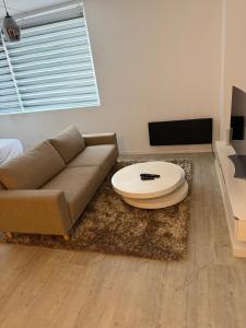 a living room with a couch and a coffee table at Casaejon in Lelystad