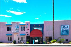 a rendering of a building with a red door at Sands Inn & Suites Lake Havasu City in Lake Havasu City
