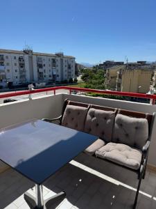 a table and a couch on a roof at Domus Relax in Battipaglia