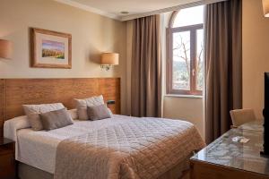 Krevet ili kreveti u jedinici u okviru objekta Hotel San Juan de los Reyes