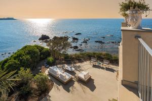 a balcony with a view of the ocean from a building at Torre dei 7 Frati in Cefalù