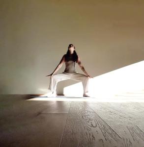 a woman sitting on the floor in a room at Hotel Belvedere - Fine Dining, Hideaway & SPA in San Genesio Atesino
