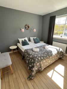 a bedroom with a large bed and a window at Kaptenshuset B&B och Hotell in Kivik +54 photos