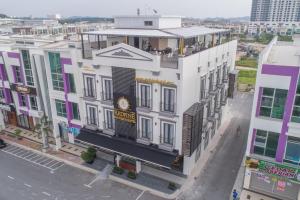 an overhead view of a building on a city street at Redpine Hotel in Skudai