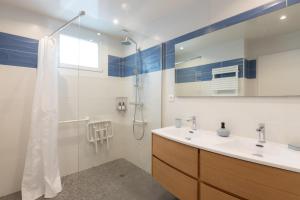 a bathroom with a sink and a shower at Villa NOVA in Capbreton +32 photos