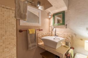 a bathroom with a sink and a mirror at Ma Maison De Loin - Luberon in Apt +61 photos